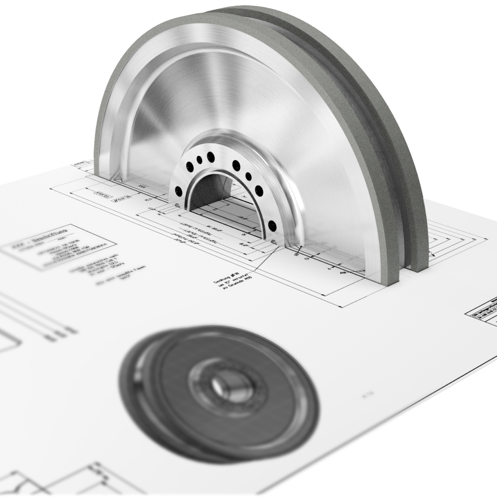 Närbild av en metallisk skiva med flera hål, delvis inbäddad i ett papper med tekniska ritningar. Ritningarna inkluderar detaljerade scheman och text, och papperet är platt med en gråskalefärg.